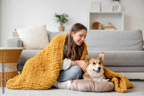 Young woman and Corgi dog w...