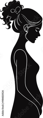 Elegant silhouette of a pregnant woman contemplating her future.