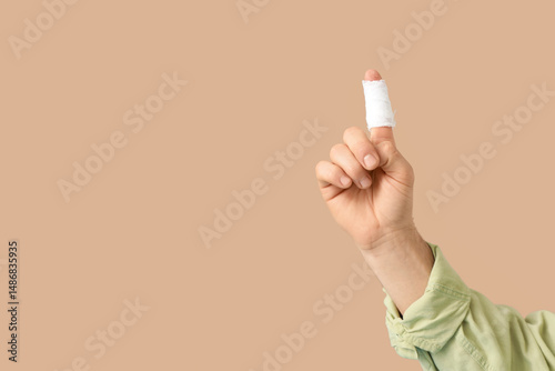 Male hand with bandaged fin...