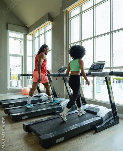 Father dad coach teacher training student kid daughter exercise sport run jogging test body on treadmill machine two people together joy fun in gym fitness class room with love care happy family time.
