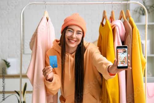 Young woman with mobile pho...