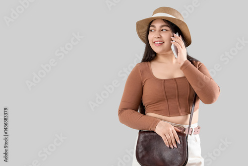 Young woman in hat talking ...