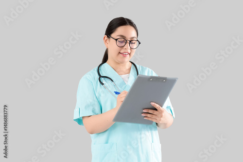 Female doctor writing in cl...