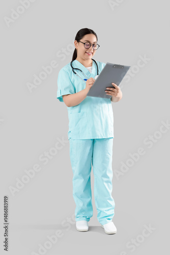 Female doctor writing in cl...