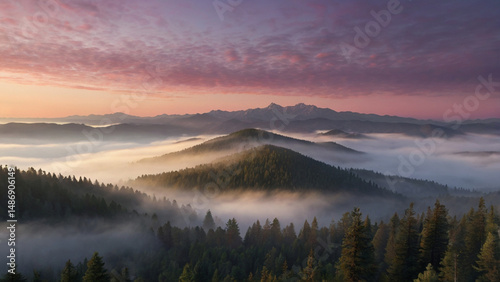 Pink and Purple Sunrise Over Foggy Mountain Range