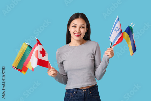 Young Asian girl with flags...
