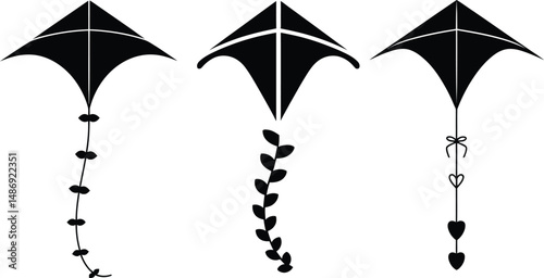 Vector illustration featuring three black silhouetted kites with various tail designs for creative usage