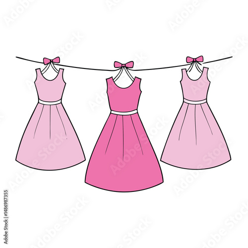 Elegant pink party dresses gracefully hang on a ribbon, showcasing soft fabrics, delicate details, and a charming touch of femininity, ready for a festive occasion.
