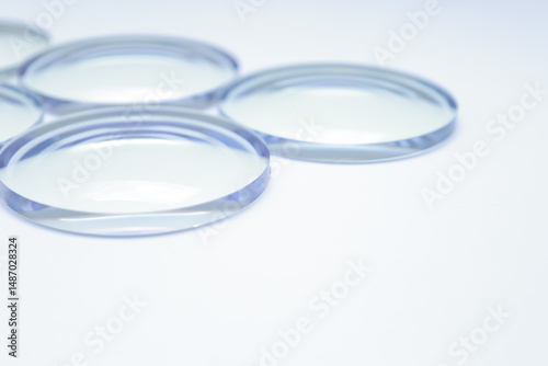 Eyeglasses lens production industry, close-up eyeglasses lenses, eyeglass lenses, glasses lenses, eyeglasses store business concept, glass lenses