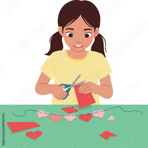 Girl crafting heart decorations for Valentines Day celebration with scissors and paper 