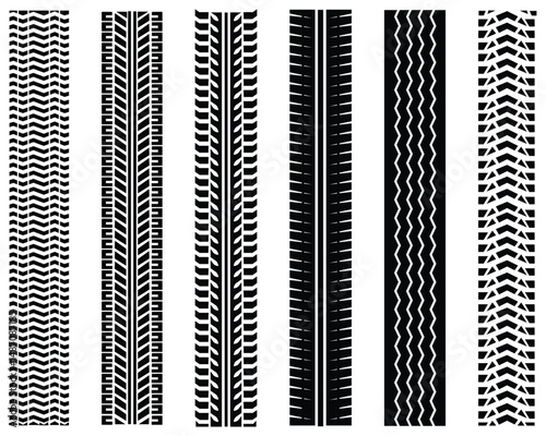 Tire tracks icon set. Silhouette of tire track mark icon vector set. Car wheel tires track footprints, tread brushes, transport ground trace marks, transport road texture. Vector illustration.	