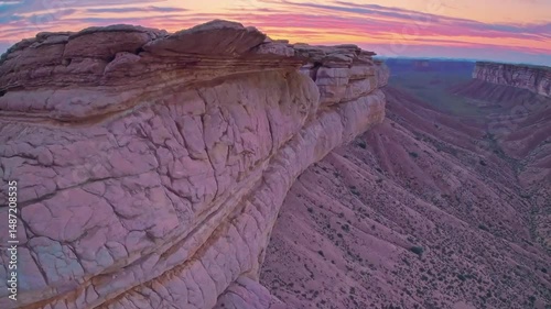 Vivid Desert Cliff Drone Shot in Cinematic Sunset Colors

