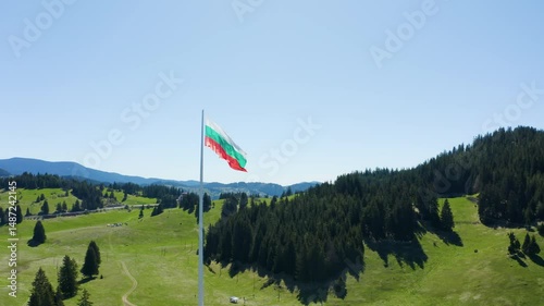 Aerial footage of the national flag of Bulgaria waving on the highest pole photo