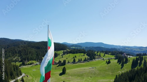 Aerial footage of the national flag of Bulgaria waving on the highest pole photo