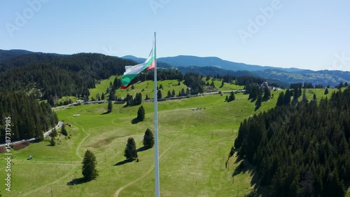Aerial footage of the national flag of Bulgaria waving on the highest pole photo