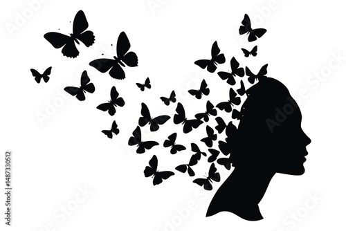 A dark silhouette of a woman is releasing butterflies from her head