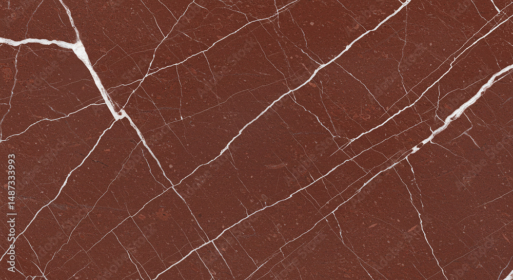 Fototapeta premium A close up of a red marble surface with white veins running across the entire surface texture design