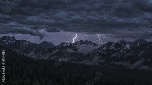 Dramatic lightning storm illuminating mountain peak at night
