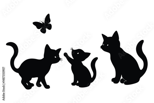 Playful kitten reaches for butterfly as its feline companion sits watching them