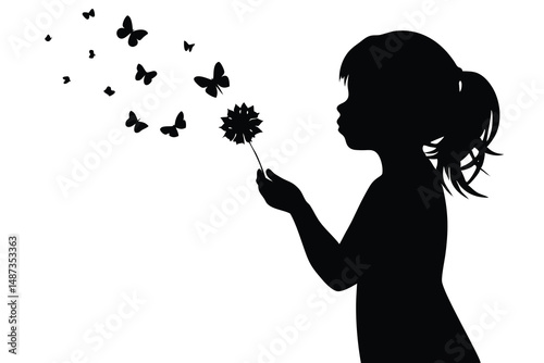 Silhouette of a girl blowing a flower, releasing butterflies into the air peacefully