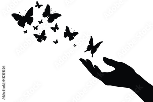 Silhouetted butterflies are released from a hand to symbolize freedom, growth and transformation