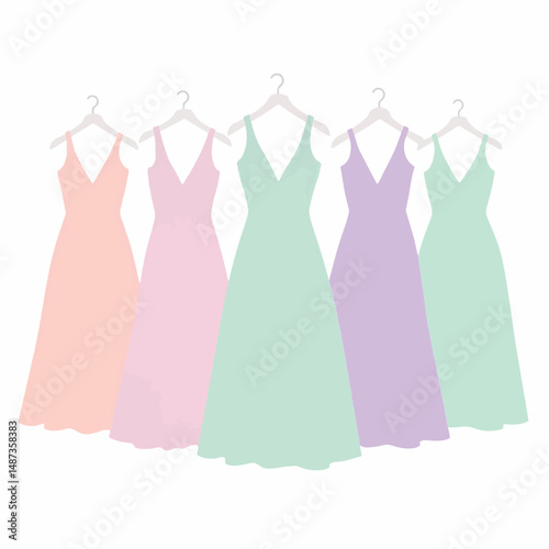Elegant pastel bridesmaids dresses hanging in a row, wedding style