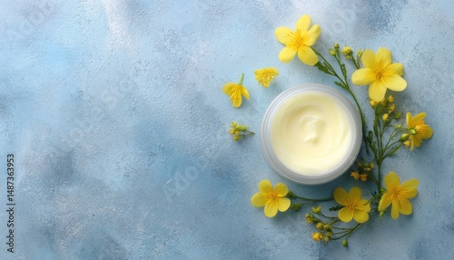 White Cream Jar with Yellow Spring Flowers on Blue Background