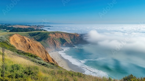 Coastal Landscape with Ocean Waves Crashing on Sandy Beach Under Foggy Sky