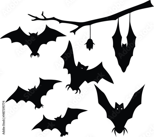 Silhouetted bats fly near tree branch with hanging bat, creating a Halloween scene