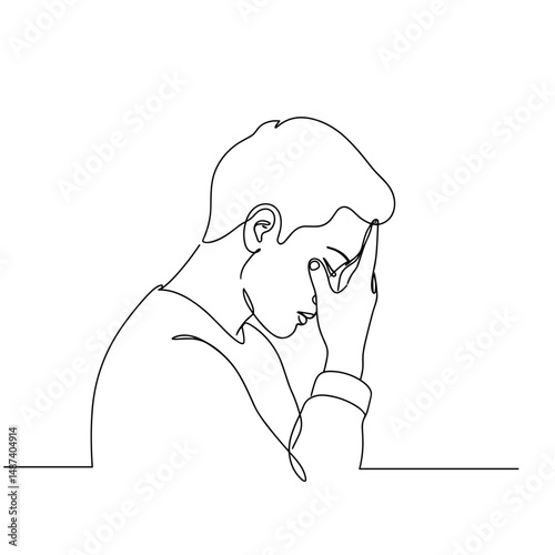 Young man expressing emotional reflection with hand on forehead  