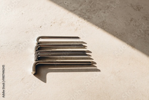 Metal allen wrenches stacked on surface