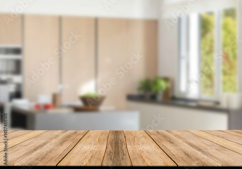 Empty wooden table and blurred kitchen background