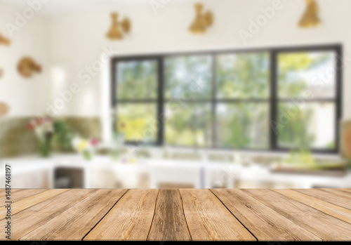 Empty wooden table and blurred kitchen background