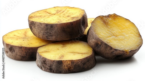 Sliced, cooked root vegetables, showcasing cut sides and skin on white