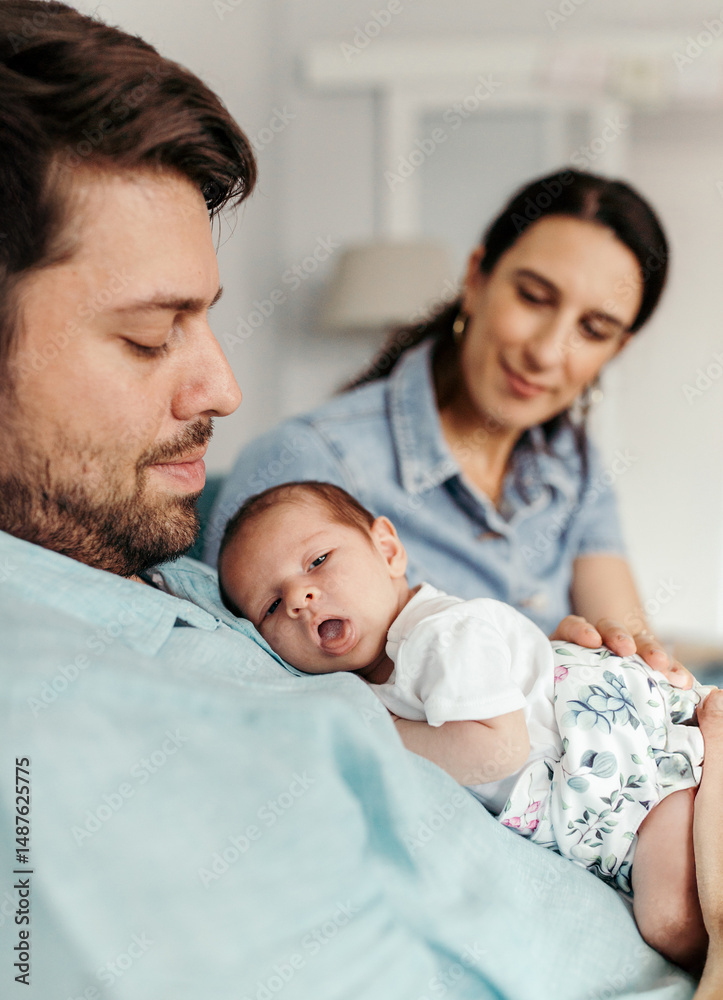 Newborn baby girl sleeping on father's chest Newborn baby girl sleeping on father's chest
