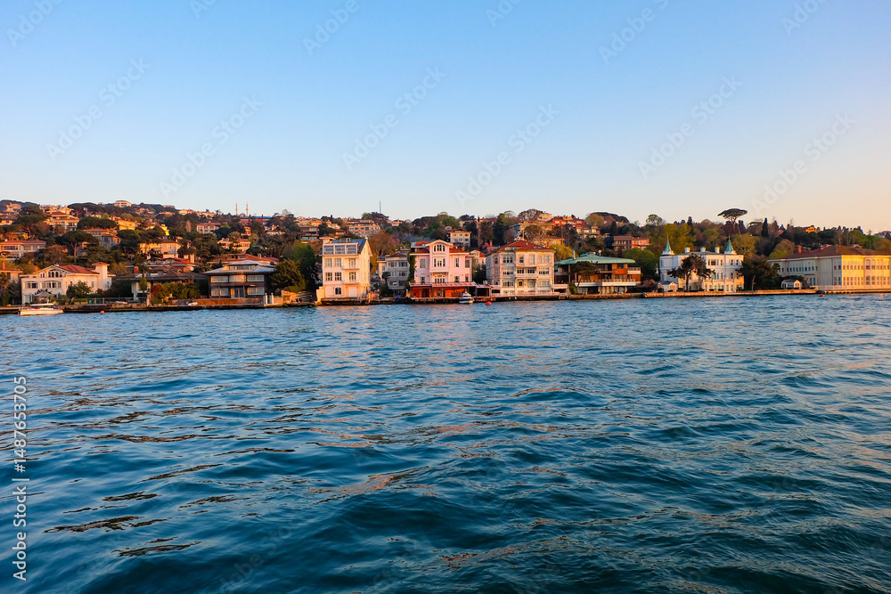 Obraz premium Bosphorus cruise along the sea in Istanbul, beautiful sunset with view of Asian and Europe side 