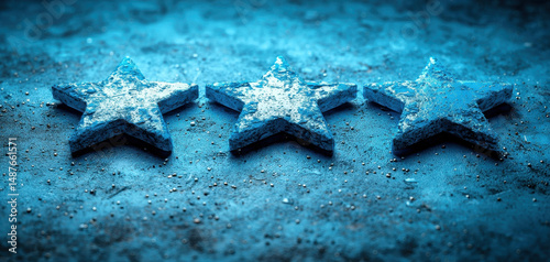 Set of three blue stars made of textured material, placed on shimmering surface. stars have frosty appearance, creating magical and festive atmosphere