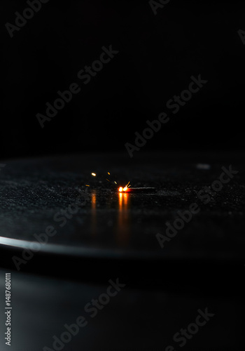 Spark on dark surface