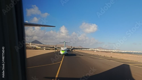 Low-cost airline departure from Lanzarote International Airport, aircraft taxiing before takeoff. photo