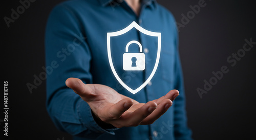 A person holding a tablet with a security shield and various icons floating above it on a black background