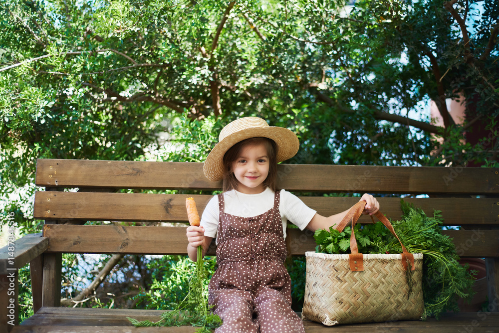 Obraz premium little cute girl on a farm in summer