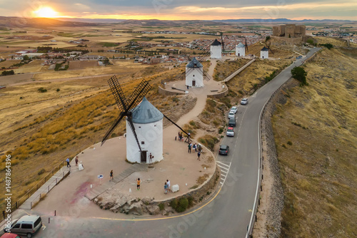 Aerial view of the windmills of Consuegra at sunset, Castilla-La Mancha, Spain.