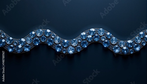 Blue and silver necklace with many diamonds. The necklace is long and has a wavy design
