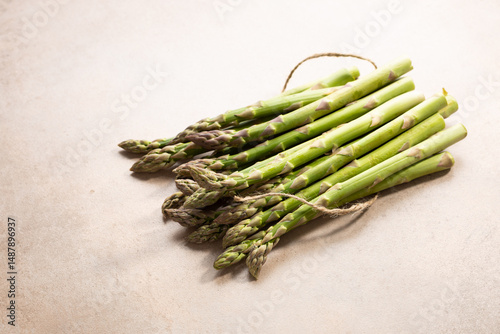Fresh green asparagus on stone surface healthy food