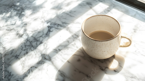 Warm light flat lay of a coffee mug in a cozy caf lifestyle scene on marble table