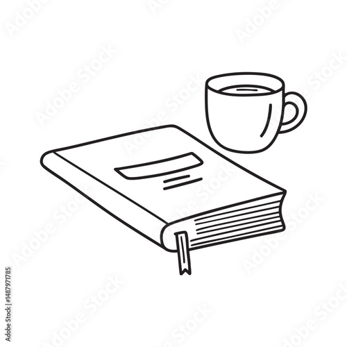 A textbook lying beside a cup on a study desk