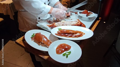 Slicing succulent roast Peking duck in Shanghai's vibrant culinary scene at dinner event. 