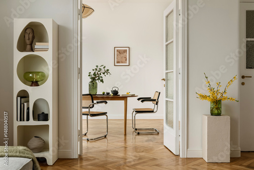 Принти на полотні Minimalist dining room with mid-century modern chairs, wooden table and a green vase with yellow spring flowers