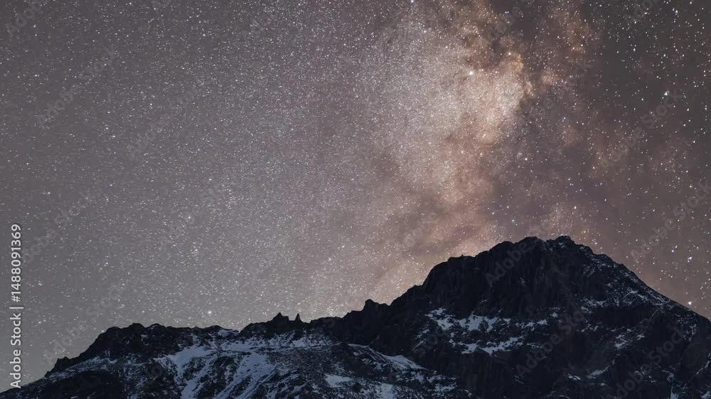 Beautiful night sky  time lapse with Milky Way galaxy over the mountains. Night tight landscape starry sky.