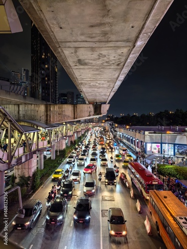 Evening traffic under Bangkok skytrain line
